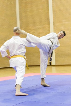 WSKF Australia - Doubleview Karate Club Pic 3 - Ryan doing a Ushiro Mawashi Geri Round house back kick to Troy in Doubleview Senior class