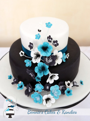 Bonnie's Cakes & Kandies Pic 3 - Black white engagement cake with black white blue blossoms by Bonnies Cakes Kandies Gympie Sunshine Coast cake decorator