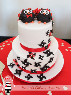 Bonnie's Cakes & Kandies Pic 2 - Custom designed red black and white wedding cake with edible owl toppers cherry blossoms and pinwheels