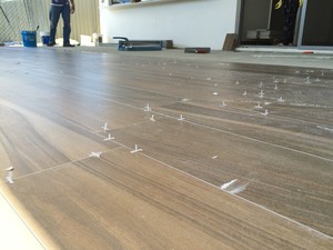 Unique Tiling Solutions Pic 5 - Timber looking long strip tiles and lay in offset running patterns Absolutely natural looking