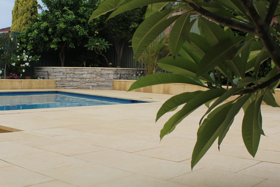 Castlestone Pic 1 - Poolside paving and bullnosing in Castlestone Beach pattern in Sunny Yellow colour