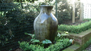 Pinnacle Landscapes & Concretors Pty Ltd Pic 2 - Beautiful pot used as a feature in this small courtyard