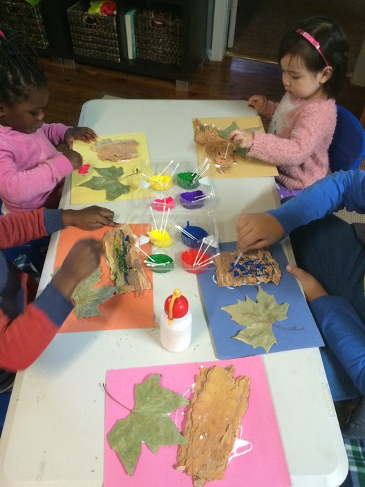 Cheryl's Family Day Care Pic 1 - Having a wonderful time creating collages out of leaves from our walk