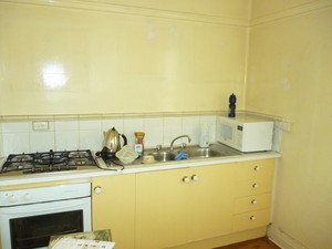 Paul Mather Pic 2 - The before kitchen There was no bench space The cupboards had water damage and the vermin had infested the cupboards