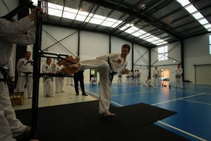 Bai Rui Taekwondo - Paddington Pic 3 - Side kick board break