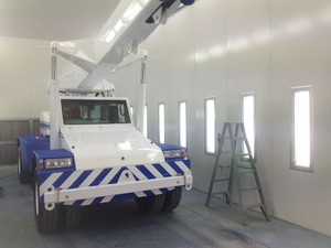 Revolution Paint & Panel Pic 2 - This is a picture of a crane in our closed spray booth