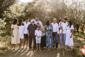 Joanna Kate Photography Pic 4 - Large family gathering together during a photo shoot at Nudgee Beach in Brisbane