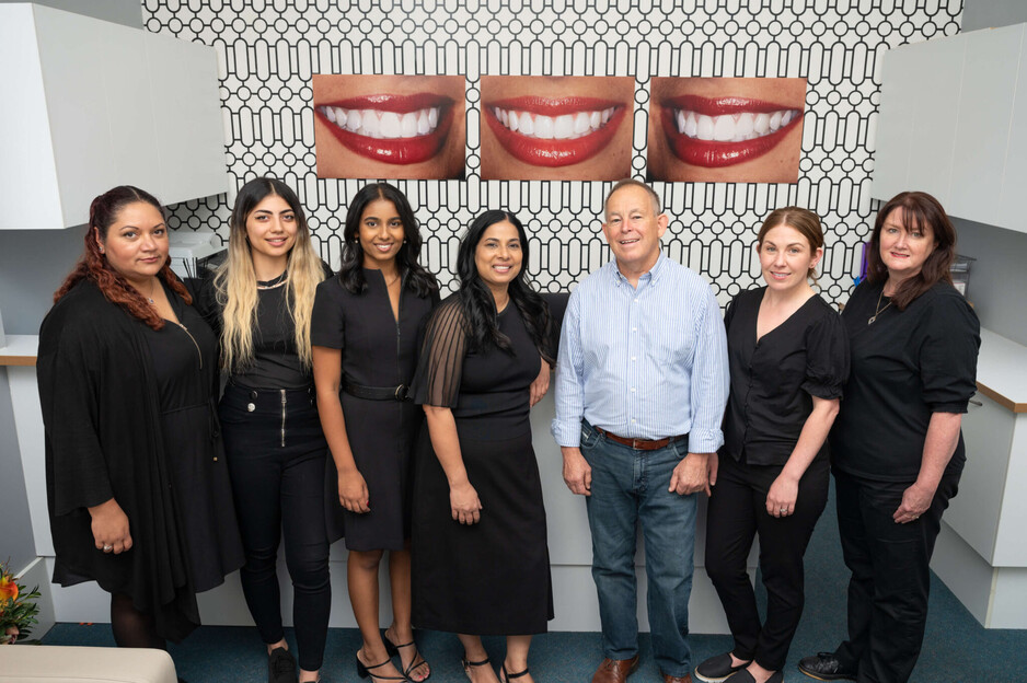 My Dentist on the Parade Pic 1 - Smiling staff of My Dentist on the Parade in front of the clinic entrance representing quality emergency dental care in Adelaide