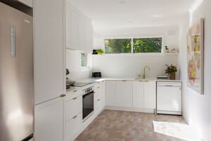 Kitchen Shack Pic 5 - White shaker style u shaped kitchen with brass fingerpull handles designed by Kitchen Shack