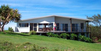 Scotts Head Beach House Pic 1 - Rear of house with deck allowing magnificent views