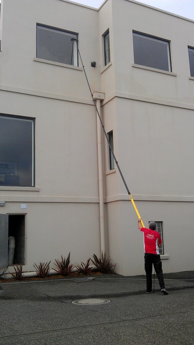 Curtis Window Cleaning Pic 1 - Using the pure water cleaning system to safely clean level 3 windows from the ground