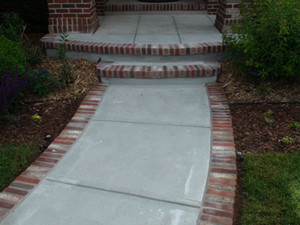 Taranto Concreting Pic 2 - Concrete pathway with brick on edge