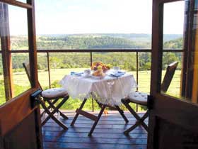 Rosebrook Cottages Pic 1 - The veranda a fantastic place to sit and watch the sunset