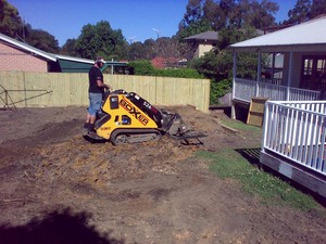 Boxxa Earthworx Pic 5 - entered through small opening in side fence next to house opening just behind the machine in this photocutfilllevel land for new landscape design