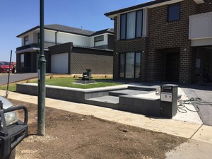 Standout Landscaping and Paving Pic 3 - Freestone block wallgranite stairs