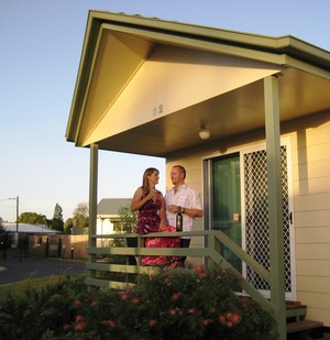 Pepper Tree Cabins Pic 2 - Relaxing on the verandah