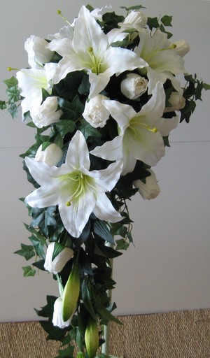 Safari's Florist and Gifts Shop Pic 3 - White oriental lilies roses