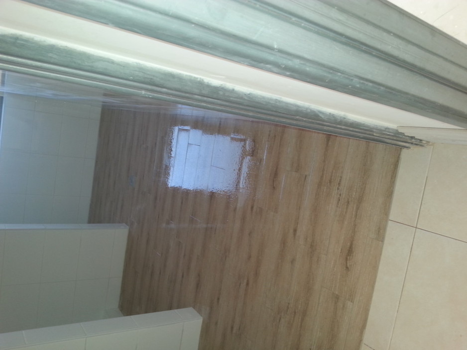 Ed's Tiling Services Pic 1 - Timber look tiles 1200mm high white tile I did 3xbathroom 1xpowder rm and laundry like this