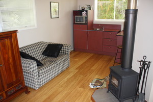 At Sunrise Cottages Pic 5 - kitchenette and fireplace