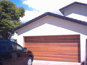 Gold Coast Door Centre Pic 5 - modern timber panel lift garage door