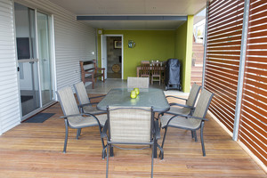 Narooma Waters Retreat Pic 2 - Extensive undercover outdoor deck complete with BBQ