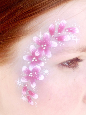 Winged FX Pic 2 - Beautiful flower design framing the face with added gems and glitter to make it shine