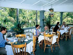 Hides Hotel Cairns Pic 1 - Enjoy a meal on the beautiful wide colonial verandahs of Hides