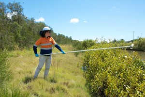 PSK Environmental Pic 4 - Assessing water quality by taking a water sample