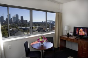 Macleay Serviced Apartment Hotel Pic 2 - Imagine rolling out of bed and eating breakfast while enjoying a view of the Sydney Skyline