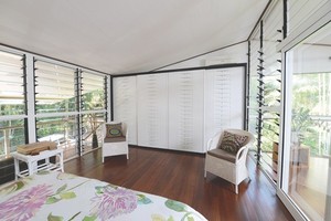 Form Function NT Pic 5 - The white Sukiya Sliding Doors enhance the Tropical decor We used white aluminum for the slats high gloss white panel encased in black frames wwwformfunctionntcomau