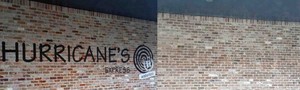 Complete Blasting Solutions Pic 2 - BEFORE AFTER dustless sandblasting to remove painted lettering and logo from brick wall