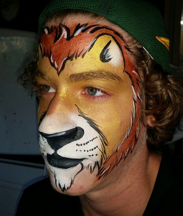 Coast Face Painting Pic 1 - Lion painted for Telstra Caloundra