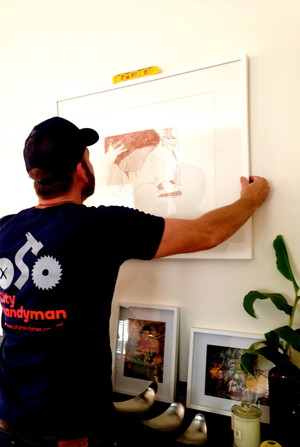 City Handyman Pic 2 - City Handyman will hang your pictures paintings mirrors certificates and wall hangings For commercial clients we can hang a whiteboard certificate artwork