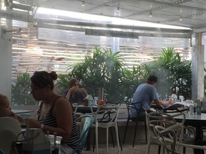 Cafe Le Monde Pic 3 - Water mists blow through the cafe keeping everyone cool