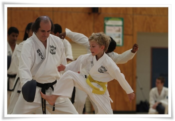 Pacific International Taekwondo Pic 1 - Instructor helping a junior class member