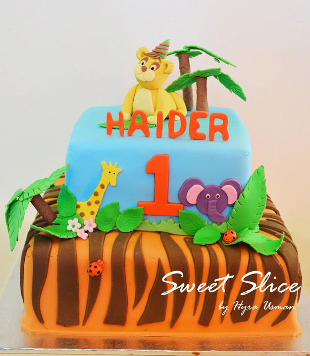 Sweet Slice Pic 1 - Jungle Themed Cake Top tier in strawberry and bottom tier in Chocolate flavor