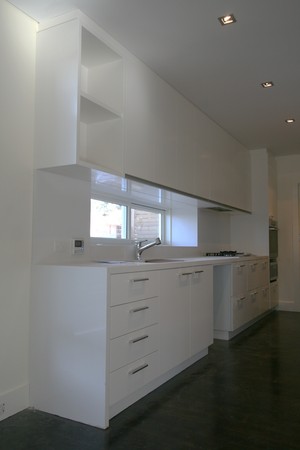 Newood Joinery Pic 4 - White 2 pac Kitchen with no handles to top cupboard doors