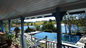 Samford Lakes Accommodation Pic 2 - The view from Honeymoon Bay and The Cottage overlooking the swimming pool and lake