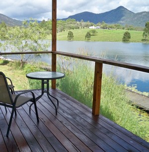 Samford Lakes Accommodation Pic 4 - The deck of the Spillway Cottage