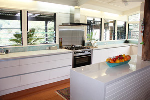 APT Creative Kitchens Pic 5 - Modern kitchen in a country setting featuring a waterfall end panel APT Creative Kitchens