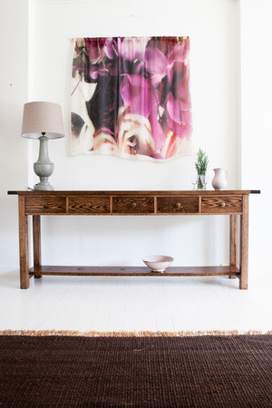 Sia & me Pic 3 - Console American Oak 5 draws dark timber stain Cashmere and model shawl hung above console Lamp with linen shade bowl and jug handmade in Morocco