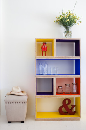 Sia & me Pic 2 - Plywood cube shelving finished in the colour of your choice Ottoman upholstered in Polish linen Hat Tin toys glasswear and jars all available in store