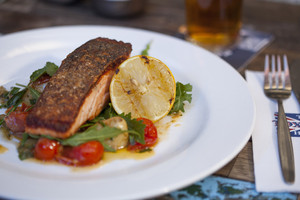 Toxteth Hotel Pic 3 - Crisp skinned salmon green olives marinated tomato and kipfler potatoes with roasted garlic lemon and thyme dressing gf