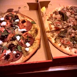 Houda's Kitchen Pic 5 - takeaway pizza Rocky special left and lamb bajeen right