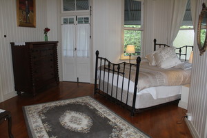 Kilkivan Country Bed and Breakfast Pic 2 - The Colonial room has a pressed metal ceiling air con french doors to the verandah and a spacious ensuite