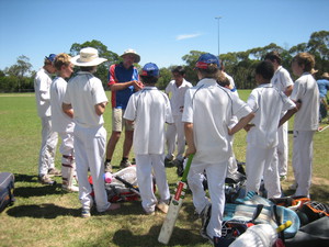 Kissing Point Cricket Club Pic 2 - U13 coach talking team tactics in the drinks break