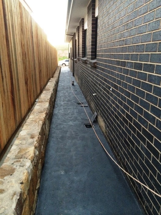 A1 Construction Pic 1 - Stone Retaining Wall Concrete Footpath