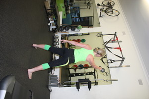 Better Life PT Studio Pic 4 - Woman performing Single Arm Kettle Bell swings