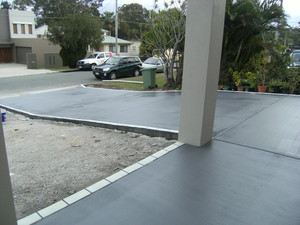 A'Court Concreting Pty Ltd Pic 3 - Placed a new driveway and entrance with a stencil border in black and white and bluestone centre