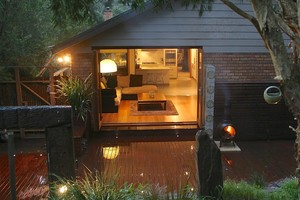 Melbourne Decking Pic 3 - Bifold doors leading to alfresco area with Merbau timber decking by Melbourne Decking